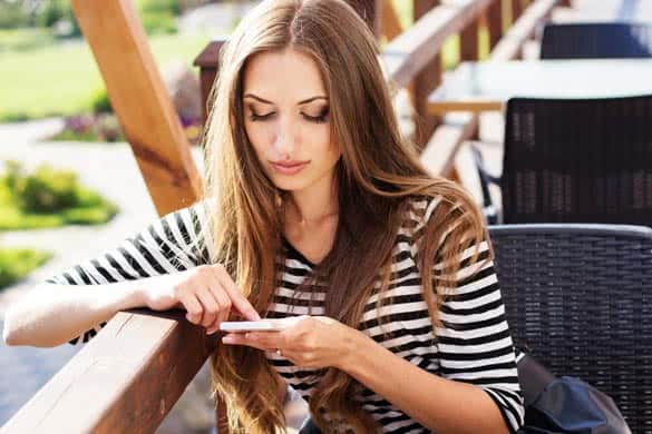 City lifestyle woman using smartphone on cafe