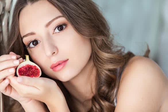Attractive woman with a fig