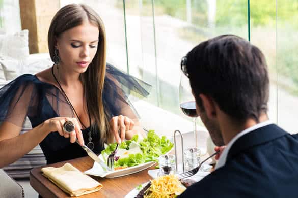 Beautiful couple eating in restaurant