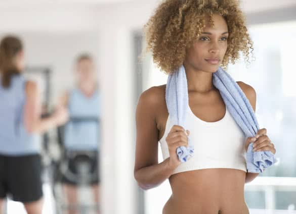 A young woman standing in a gym