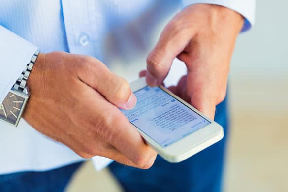 Man using smart phone for texting