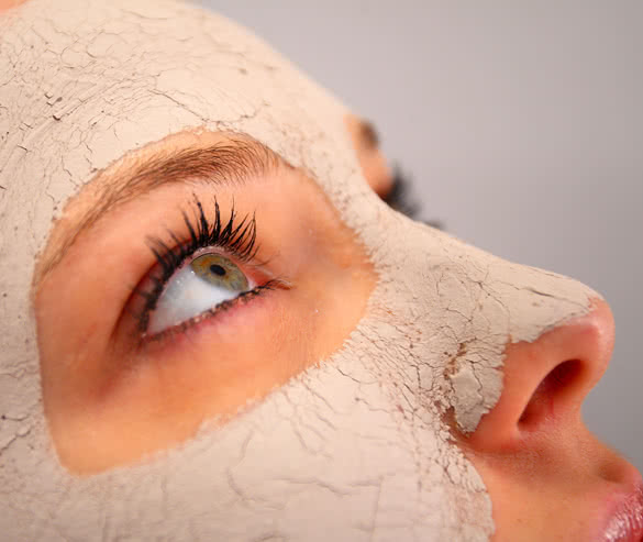 Close up of a spa clay mask on a womans face