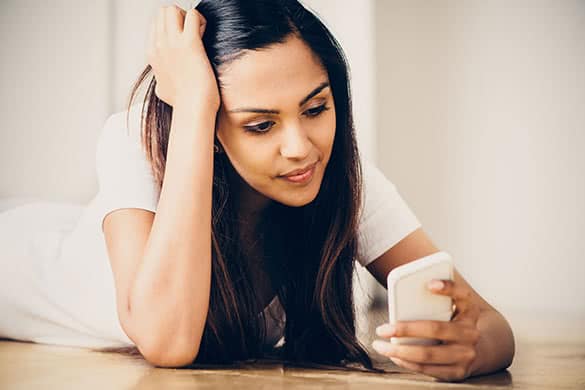 woman looking at a cell phone