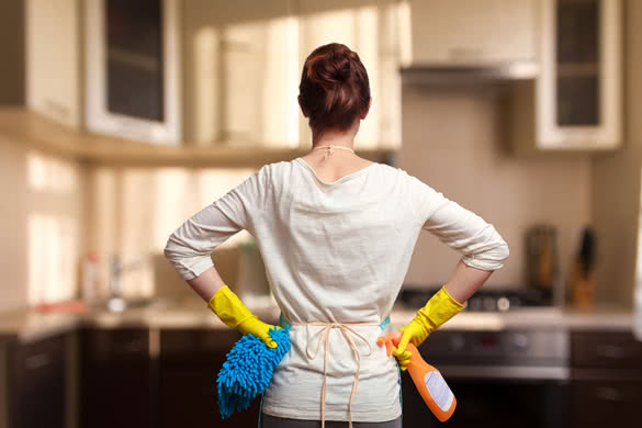 Young woman preparing to clean the kitchen