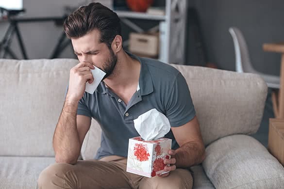 man sneezing