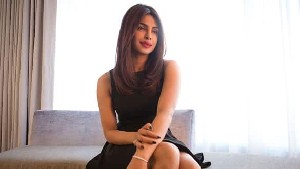 Bollywood star Priyanka Chopra poses in a hotel room as she promotes her film, "Mary Kom" at the 2014 Toronto International Film Festival in Toronto on Thursday, Sept. 4, 2014. (AP Photo/The Canadian Press, Chris Young)