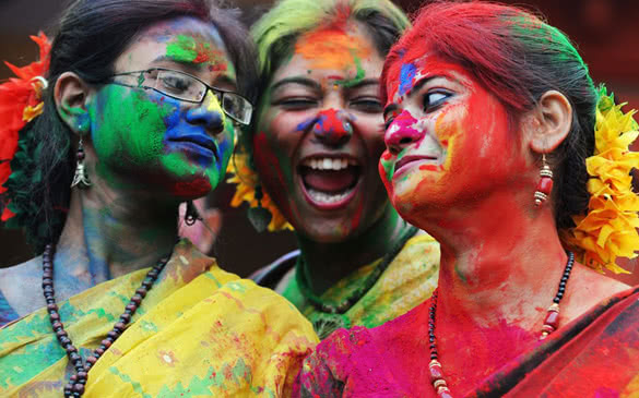 Indian students look on after exchanging Aabir (coloured dust) as they celebrate Vasantotsav, 'the Festival of Spring' in Kolkata on March 6, 2012. Vasantotsav, the spring festival is celebrated in the rest of India as 'Holi', or the Festival of Colours and is a popular Hindu spring festival observed at the end of winter season on the last full moon day of the lunar month, which usually falls in the later part of February or in March. AFP PHOTO / Dibyangshu SARKAR (Photo credit should read DIBYANGSHU SARKAR/AFP/Getty Images)