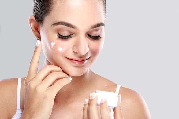 woman applying cream