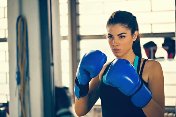 Attractive Female Boxer At Training