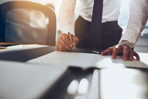 Close up business man signing contract making a deal