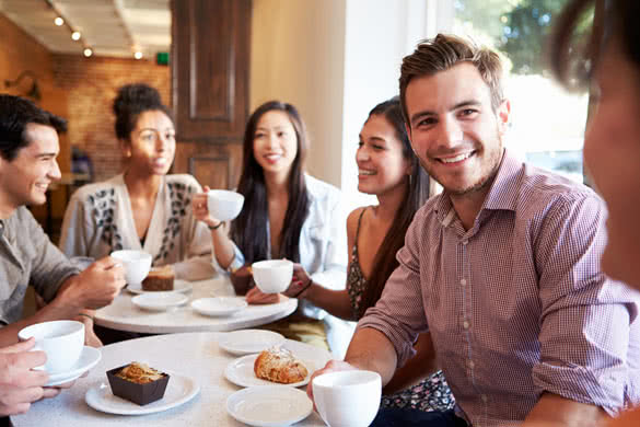 Group Of Friends Meeting In Cafe Restaurant