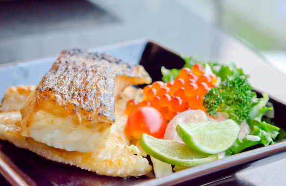 Japanese grilled cod fish and fresh salad with fish egg