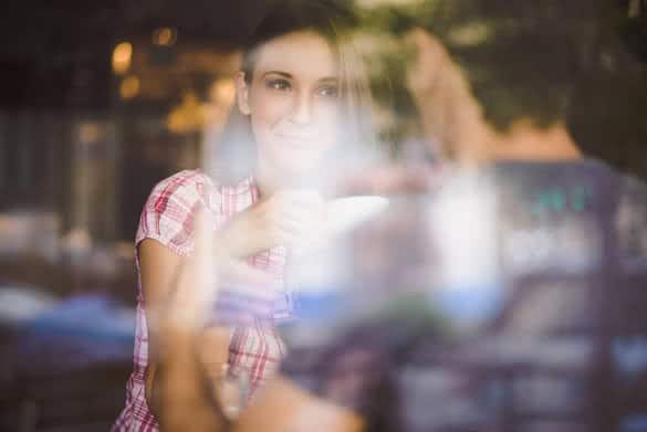 Young couple on first date drinking coffee