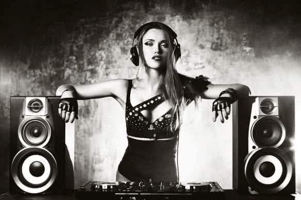 Young sexy woman dj playing music