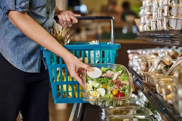 a woman shopping at a grocery store