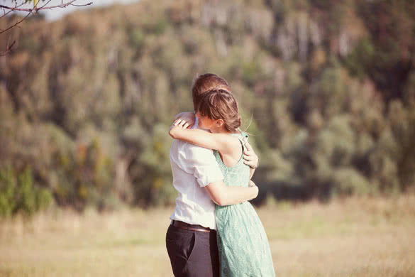 couple in love in the park at sunset