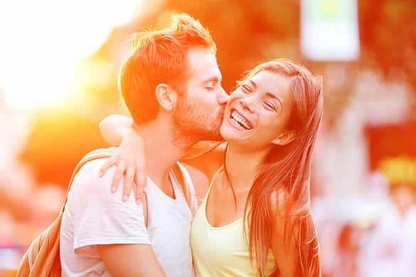 couple kissing and smiling