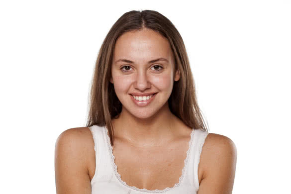 smiling young woman without make-up