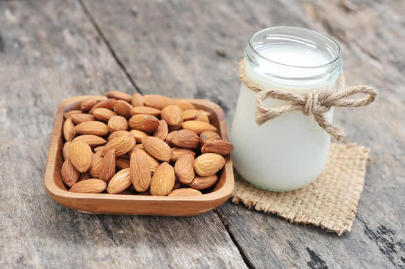 almonds milk with almonds on dish