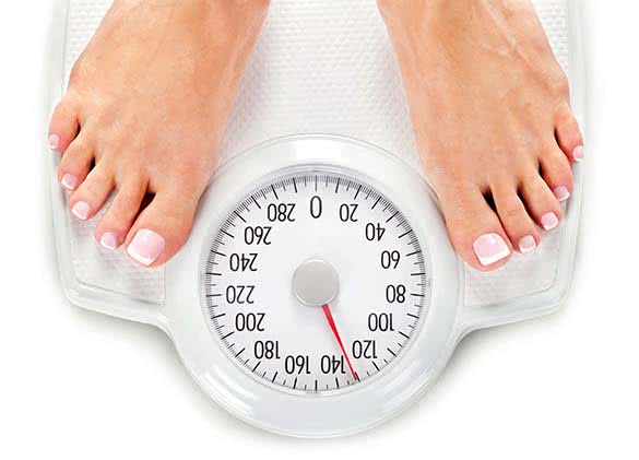 woman on a weight scale