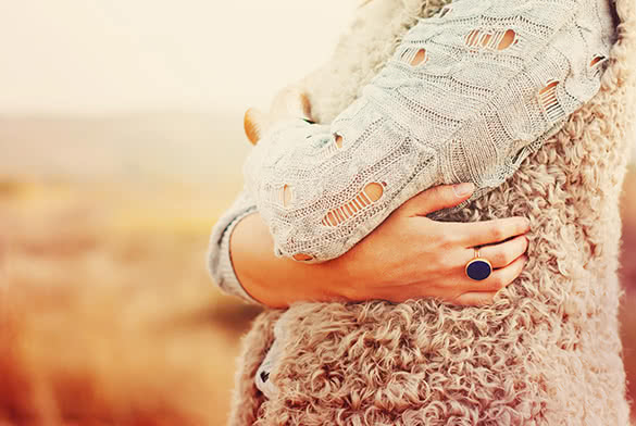 woman standing with her hands crossed