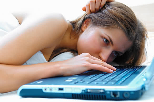 Sad woman with her computer
