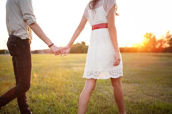 man and woman holding hands