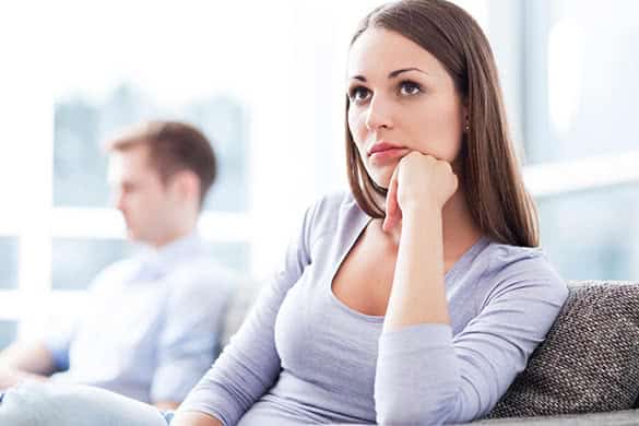 woman thinking on a couch