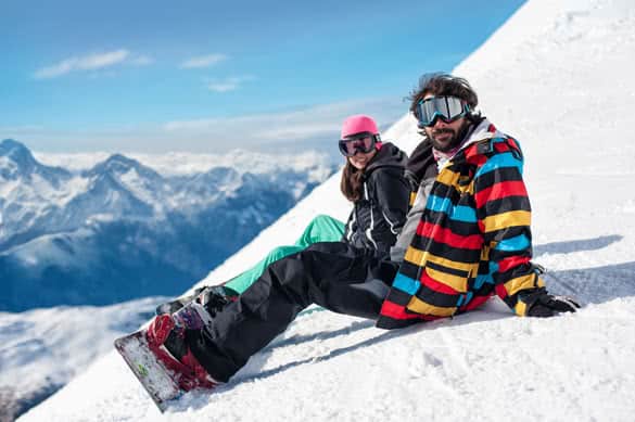 young couple enjoying winter mountains