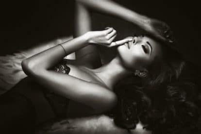 Beautiful sensual brunette woman posing in elegant lingerie