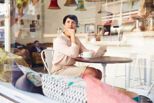 Businesswoman with digital tablet in a coffee shop