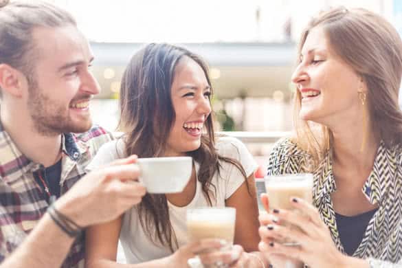 Multiracial group of friends having a coffee together