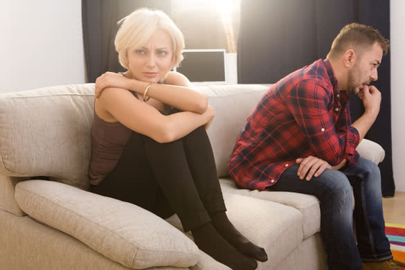 Offended couple man and woman looking sad and disappointed after quarrel concerning family life