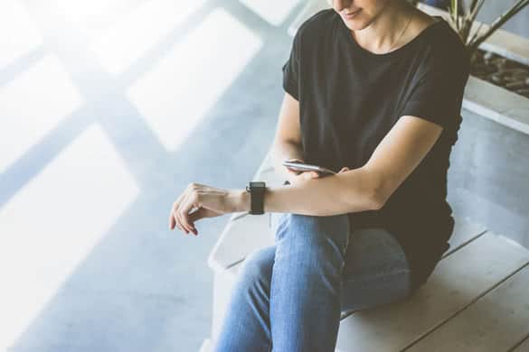 Young woman using gadget