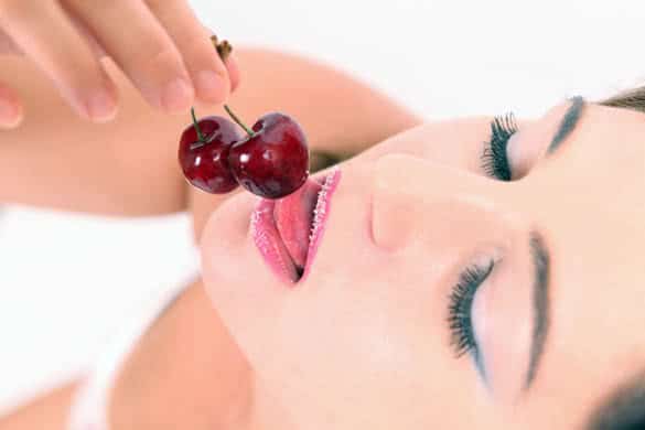 cherry and lips over white