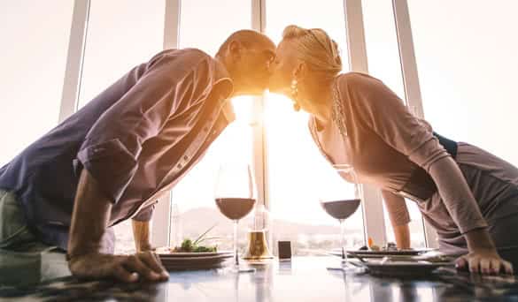 Middle age couple at the restaurant. couple interacting at lunch in a fancy restaurant