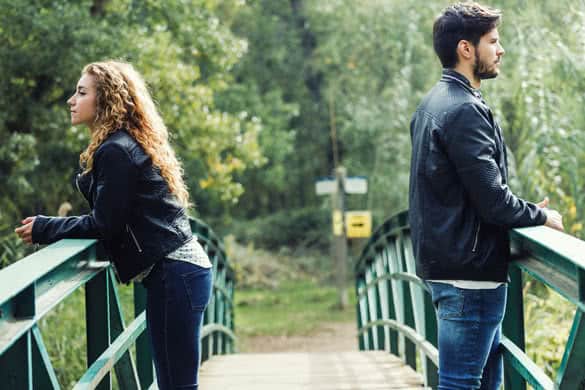 Portrait of young couple being in a conflict in the park