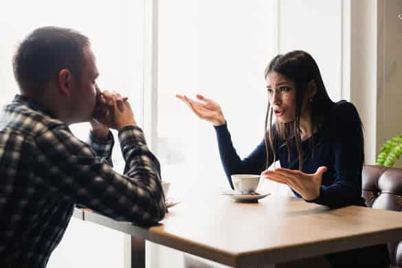 Young couple arguing in a cafe. Relationship problems