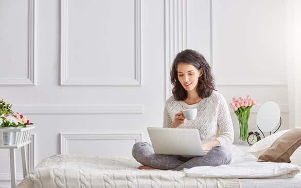 woman sitting on a bed