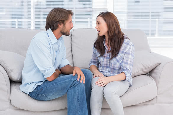 couple talking on the couch