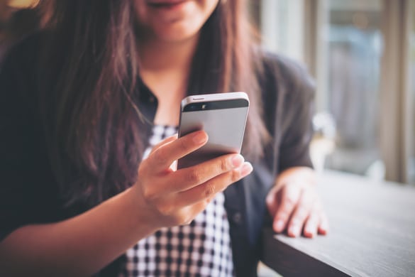 woman looking at her phone