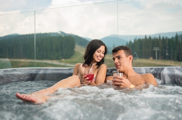 Couple enjoying outdoor jacuzzi